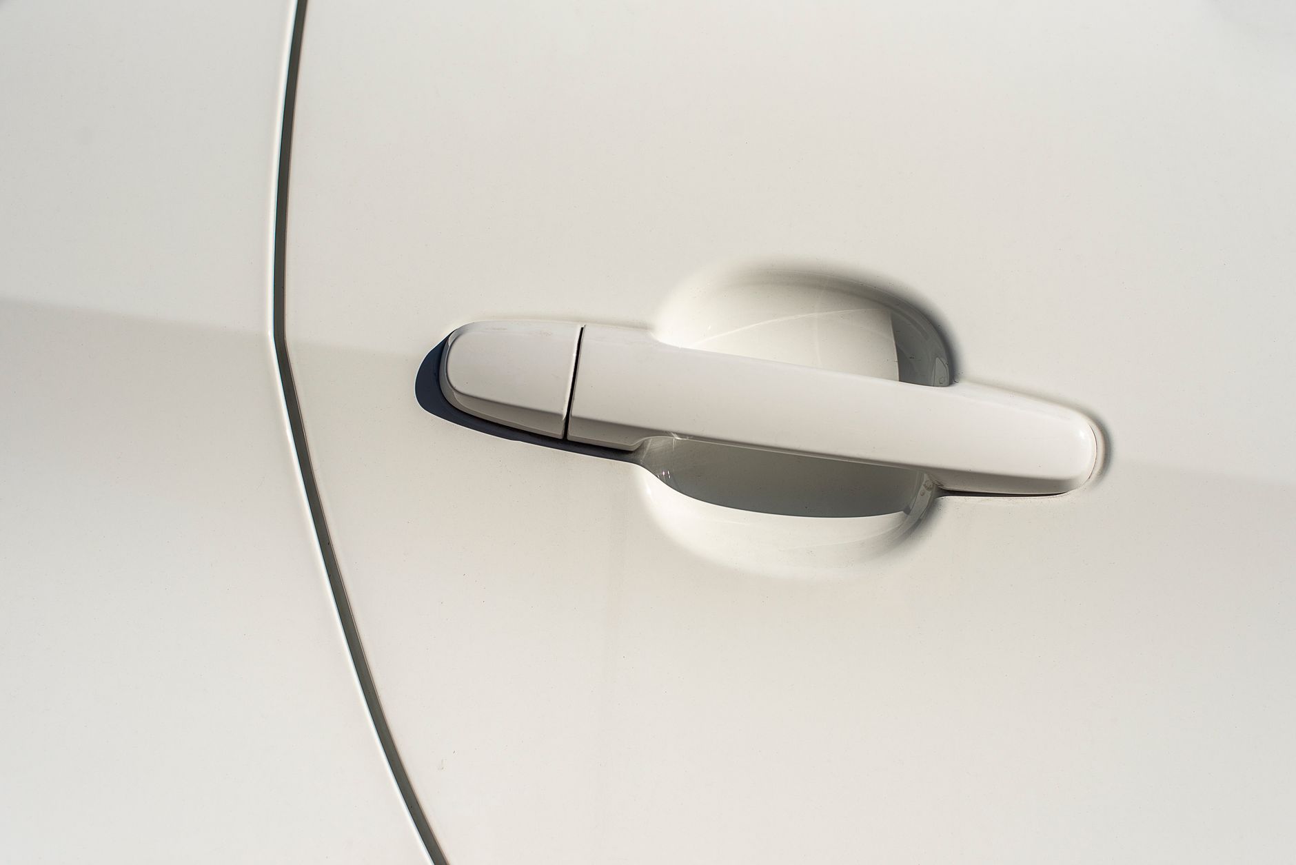 Flawless white paint on a newly protected delivery-mileage car