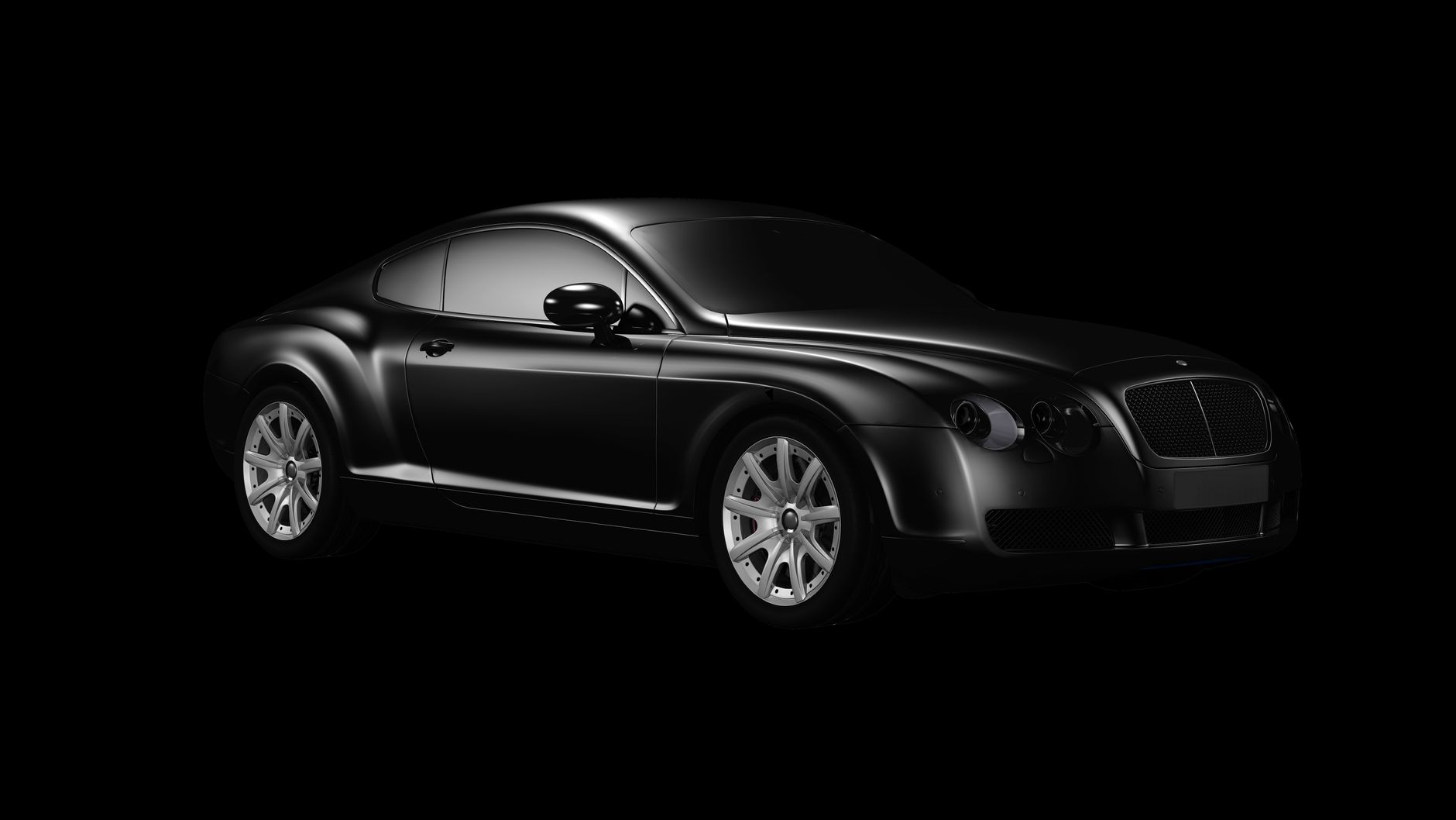 A coupe in a dark studio, its silhouette barely visible before inspection