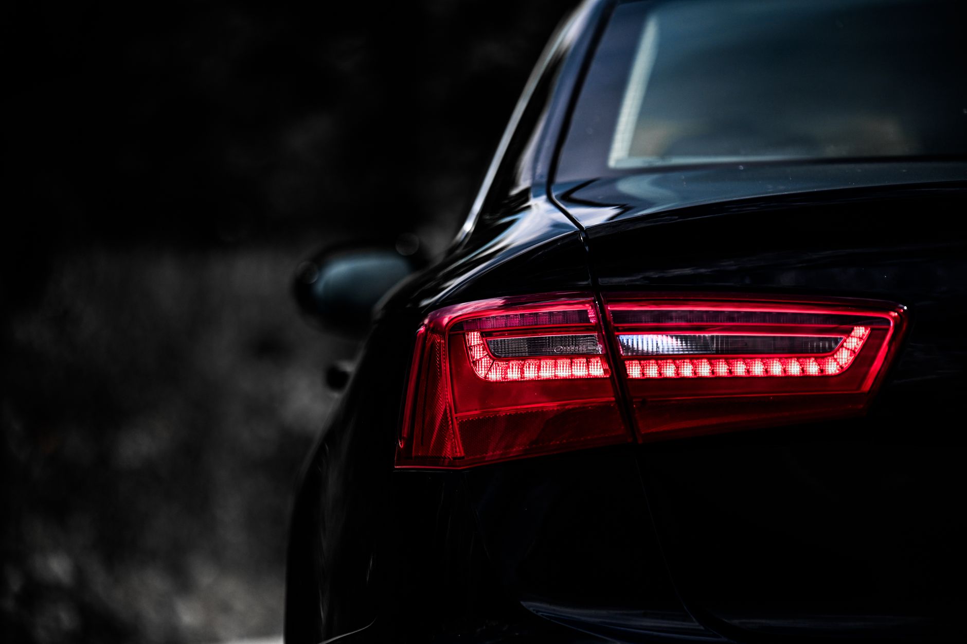Tail light and surrounding paint before correction: dull, hazed and low in contrast